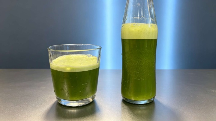Cold brew matcha tea in a glass cup and shaker bottle without a whisk